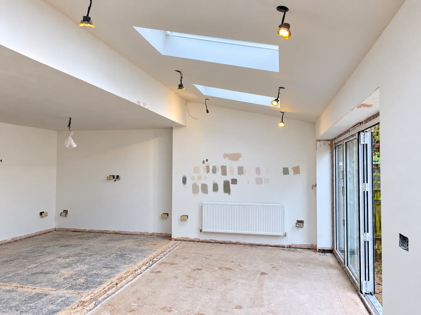 Extension interior with rooflights and garden doors during refurbishment in Ashford