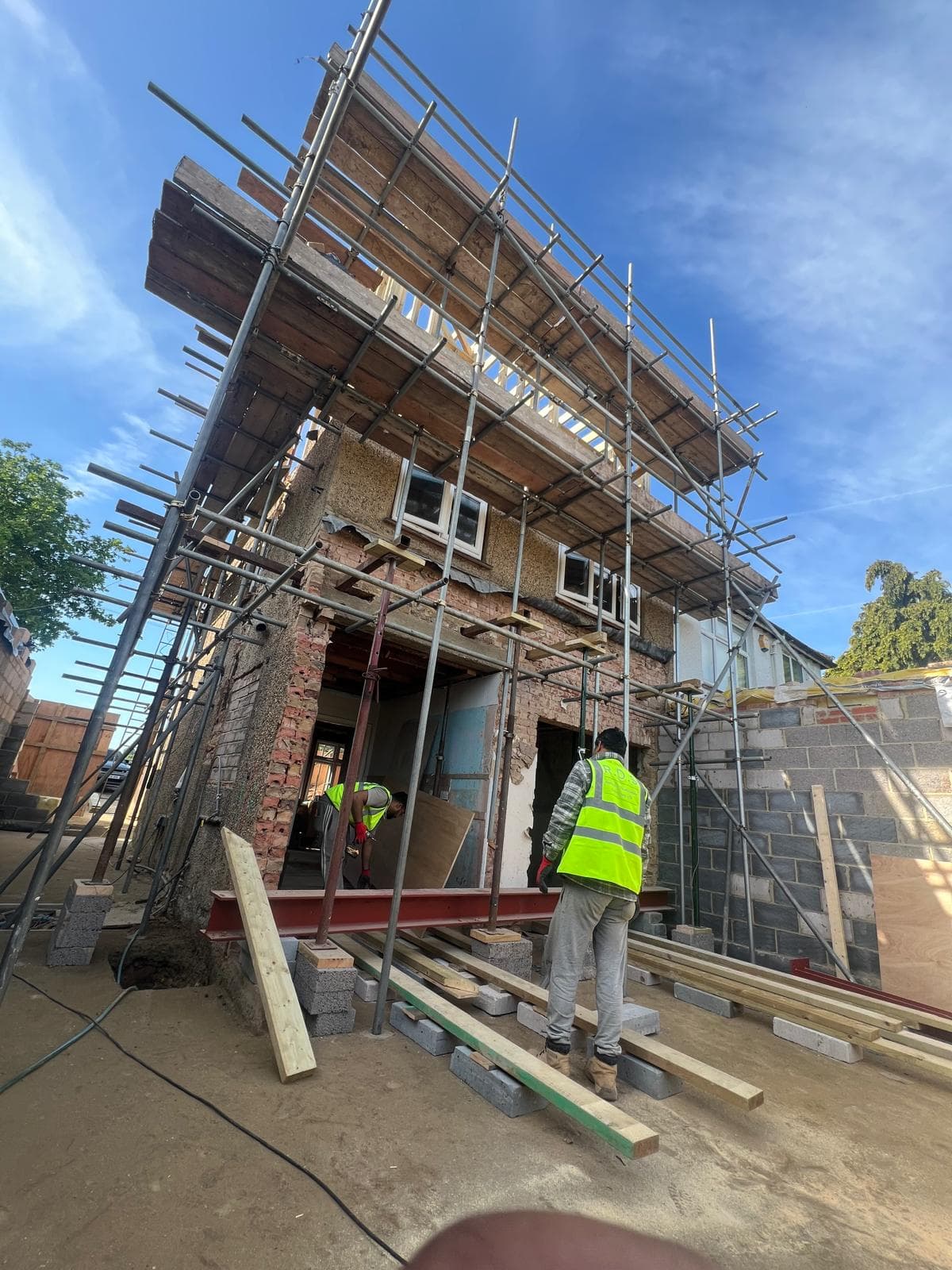 Structural steel beam installation on a residential extension