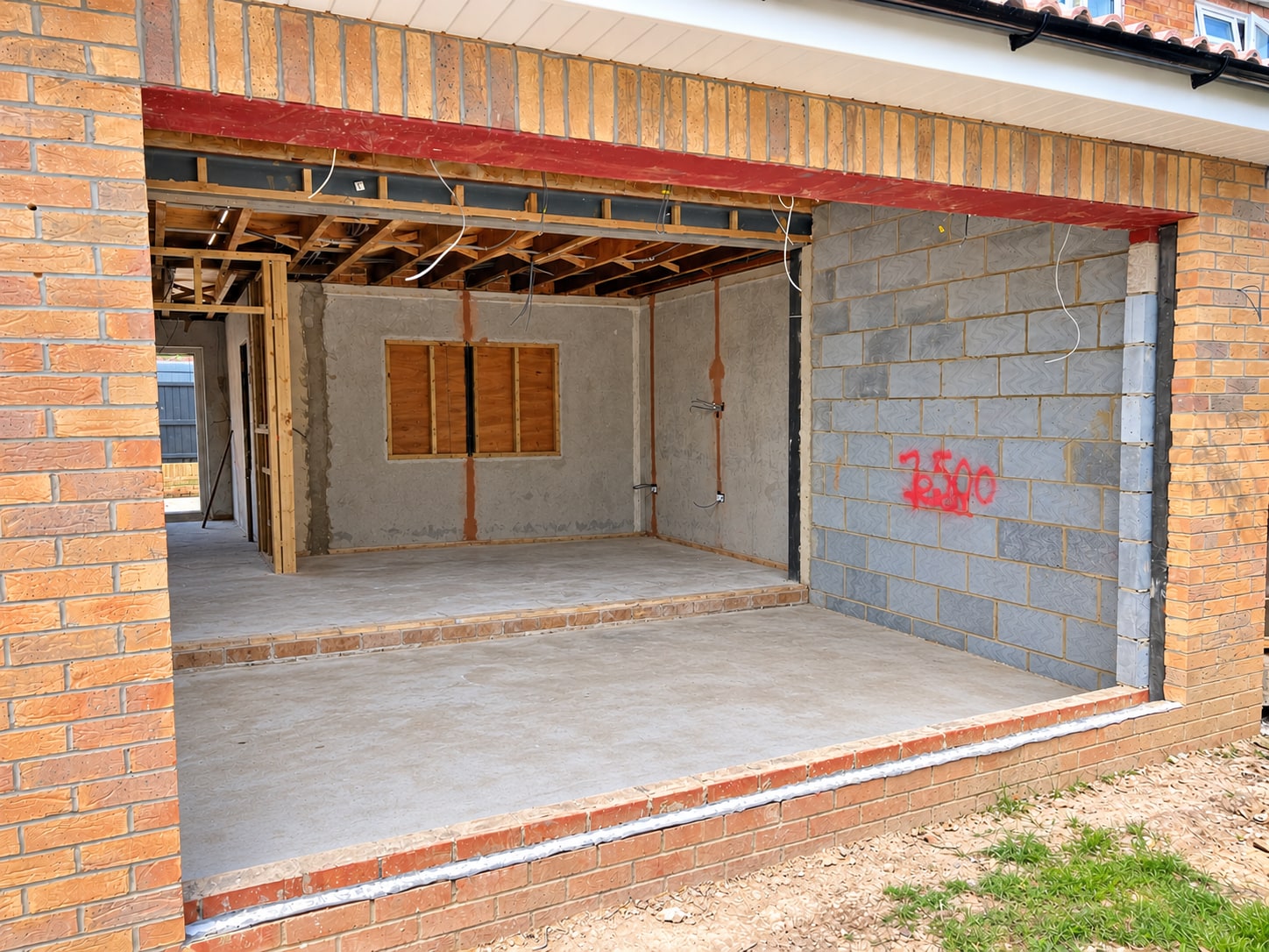 Rear extension brickwork and wide opening during construction in Ashford