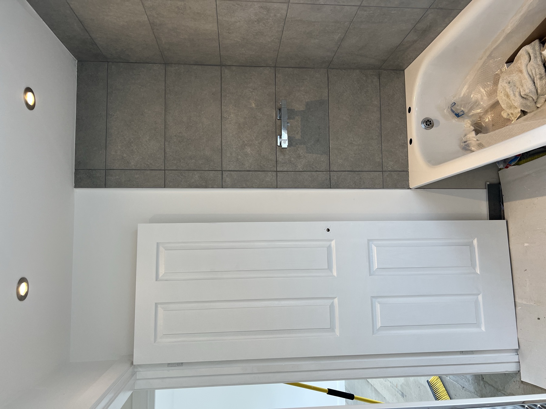New bathroom fit-out with tiling and a new bath installed