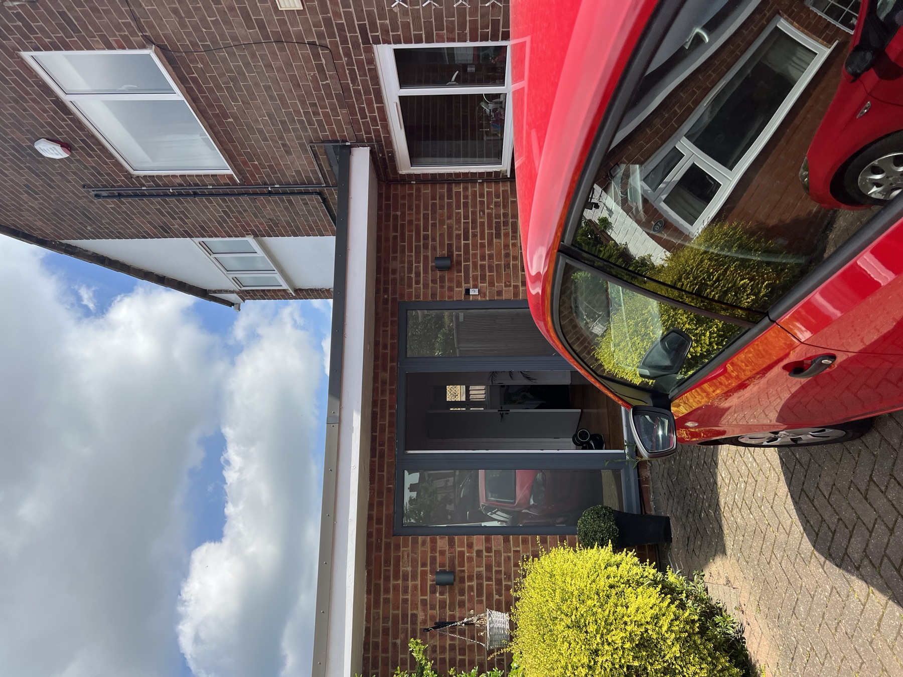Existing rear external door and brickwork of the property before construction began