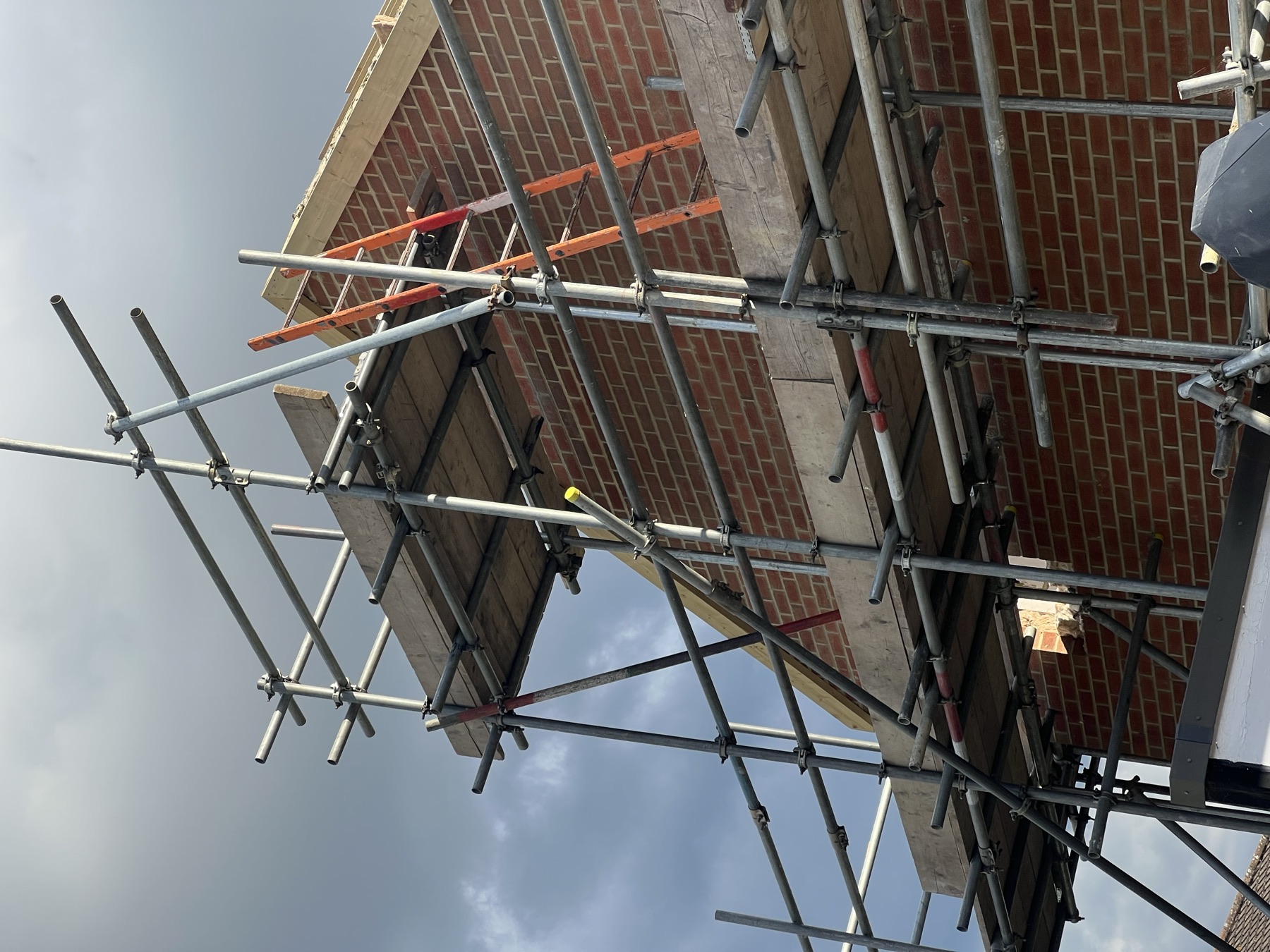 Gable end brickwork and roof timbers of the first floor extension taking shape