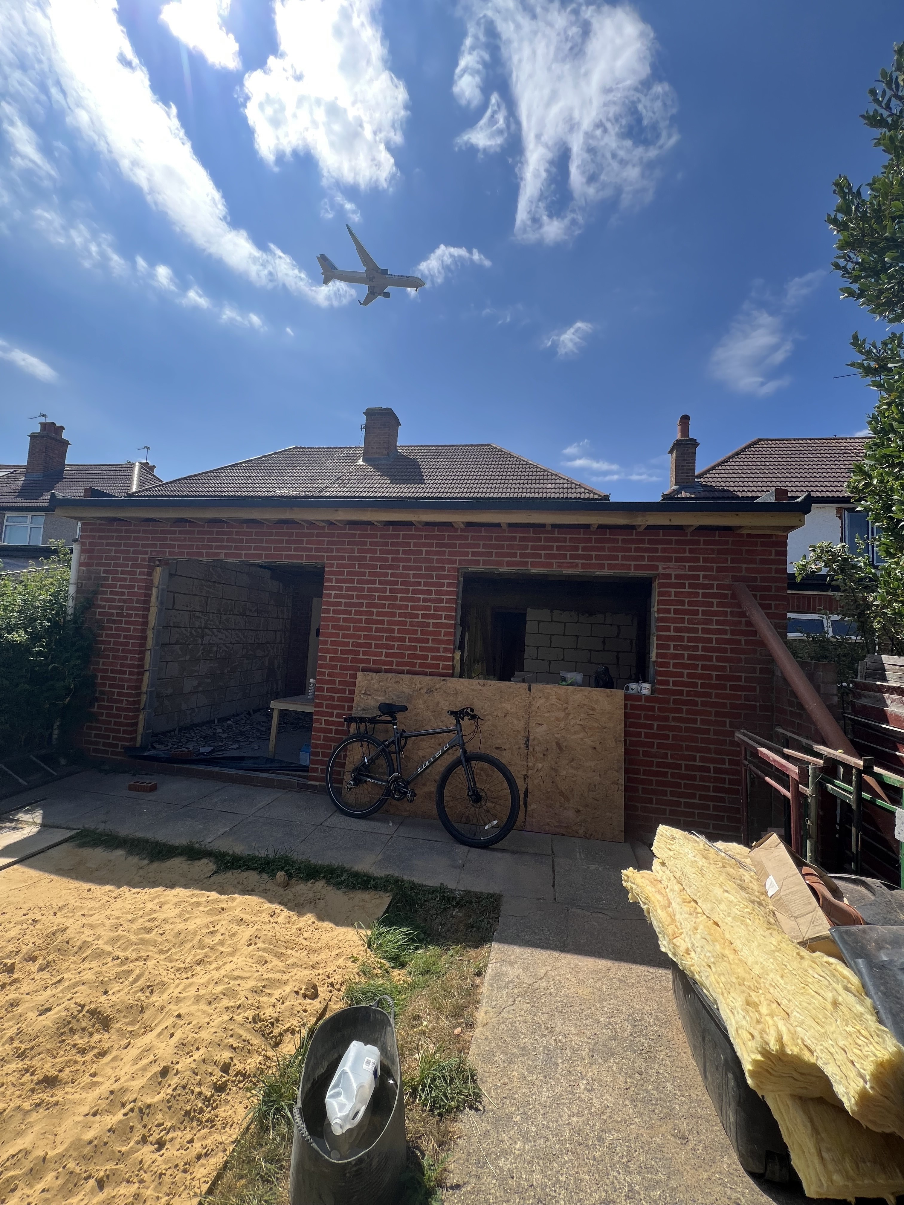 Brickwork to the rear extension under construction, built up to match the existing house
