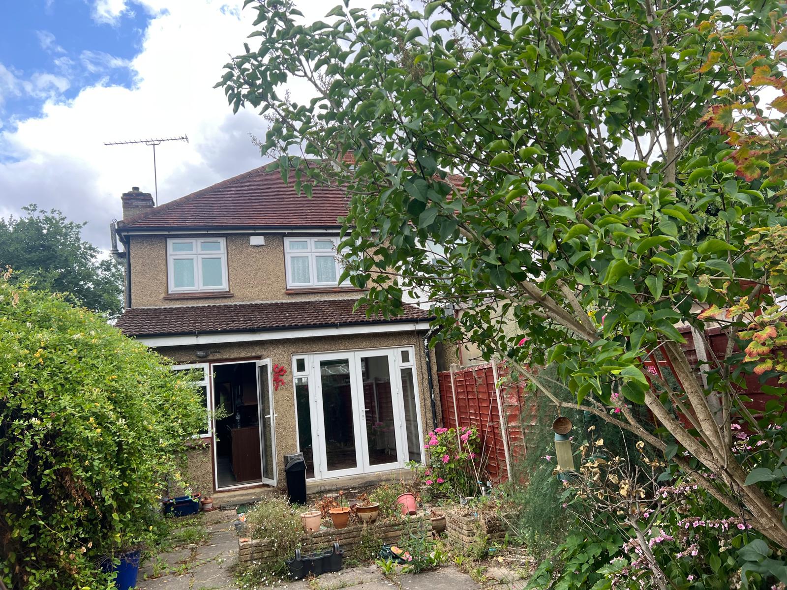 Existing rear elevation of the property before the extension and loft works began