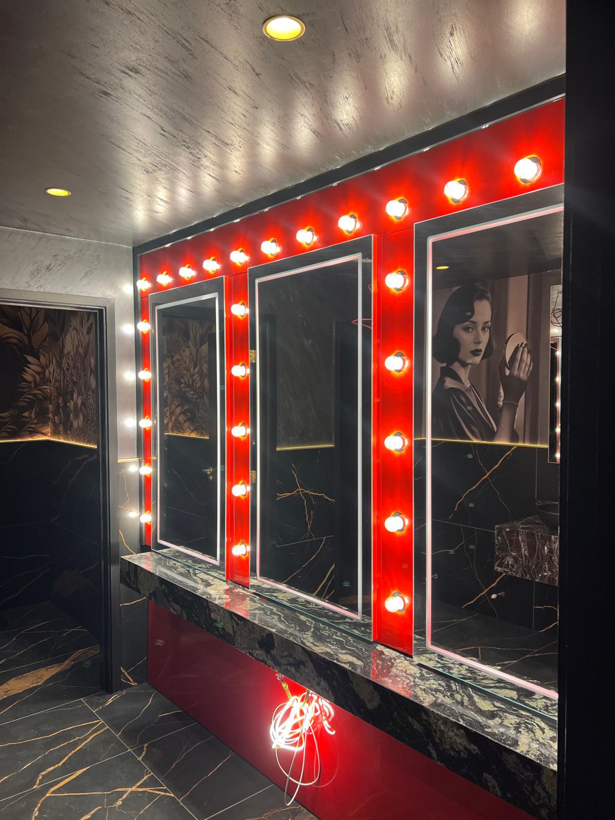 Completed illuminated vanity mirror with marble surfaces
